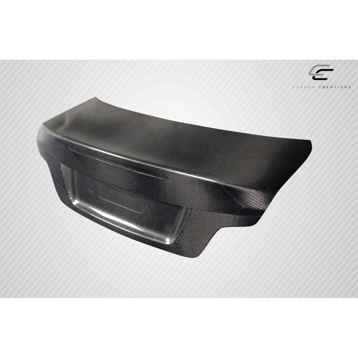 Modify your BMW 1-Series 2008 with our Exterior/Trunks - Angled view showing carbon fiber trunk part design