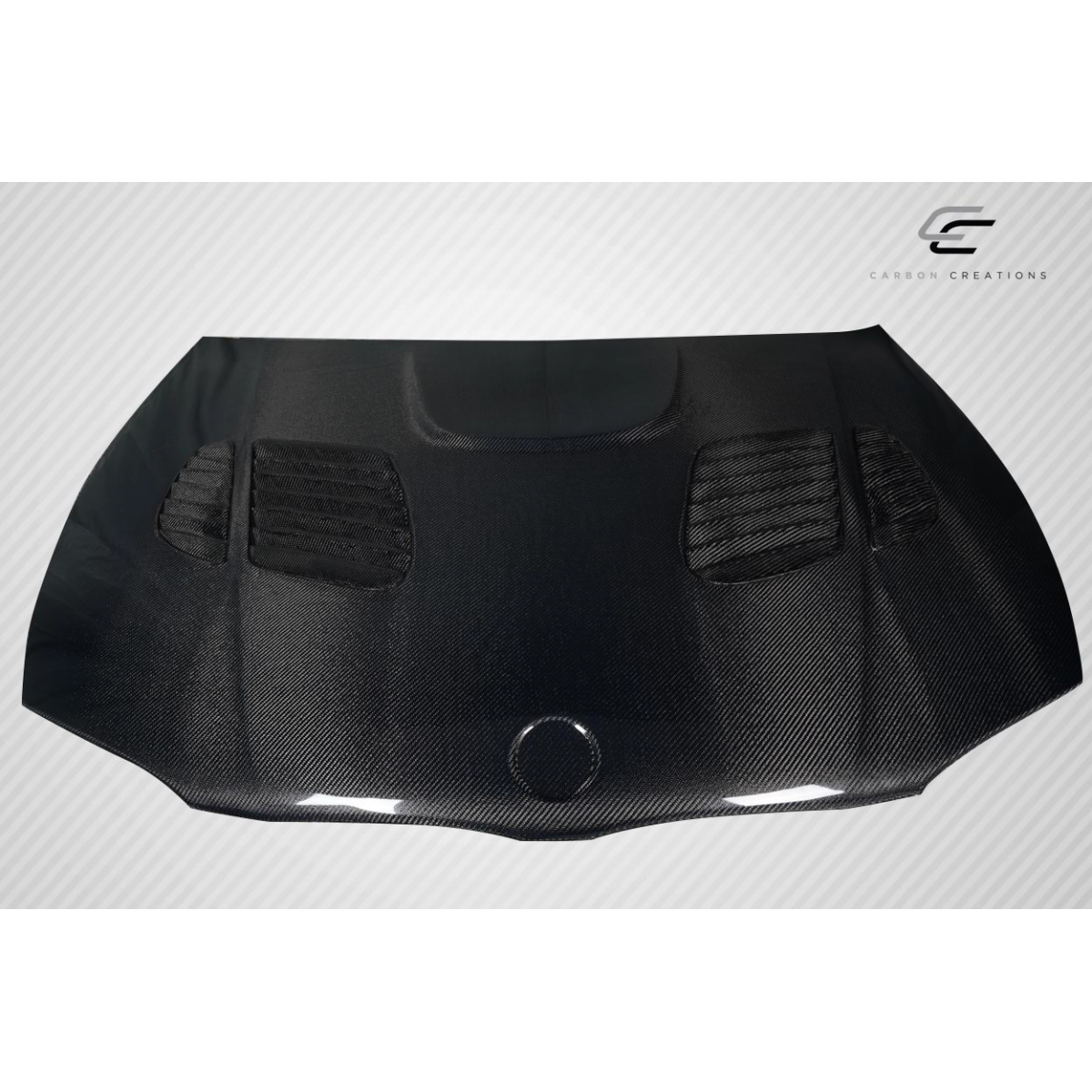 Modify your BMW 1-Series 2008 with our Exterior/Hoods - Front view of a carbon fiber hood