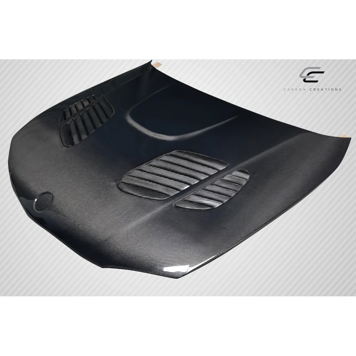 Modify your BMW 1-Series 2008 with our Exterior/Hoods - Top down angle view of carbon fiber hood