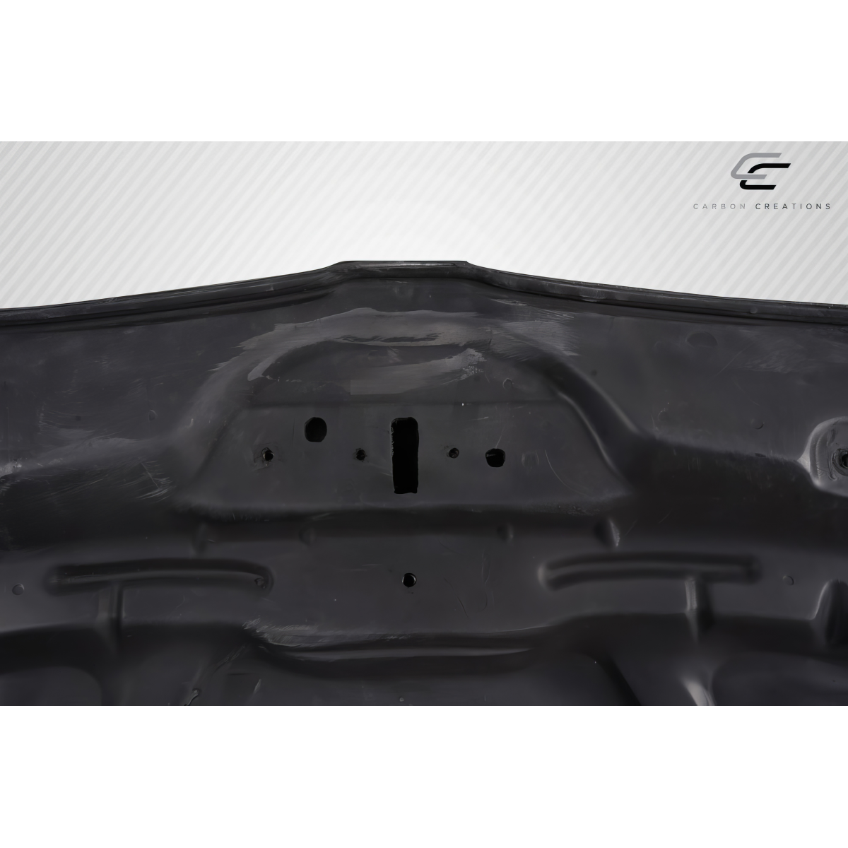 Modify your BMW 1-Series 2008 with our Exterior/Hoods - Top view of carbon fiber hood showing surface details