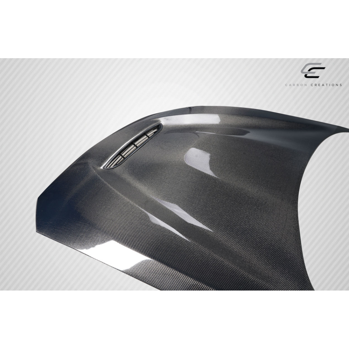 Modify your BMW 2-Series 2014 with our Exterior/Hoods - Angled view of a carbon fiber hood