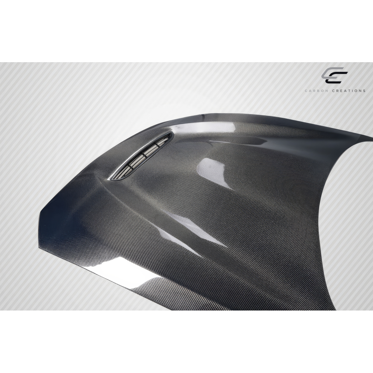 Modify your BMW 2-Series 2014 with our Exterior/Hoods - Angled view showcasing carbon fiber hood detail