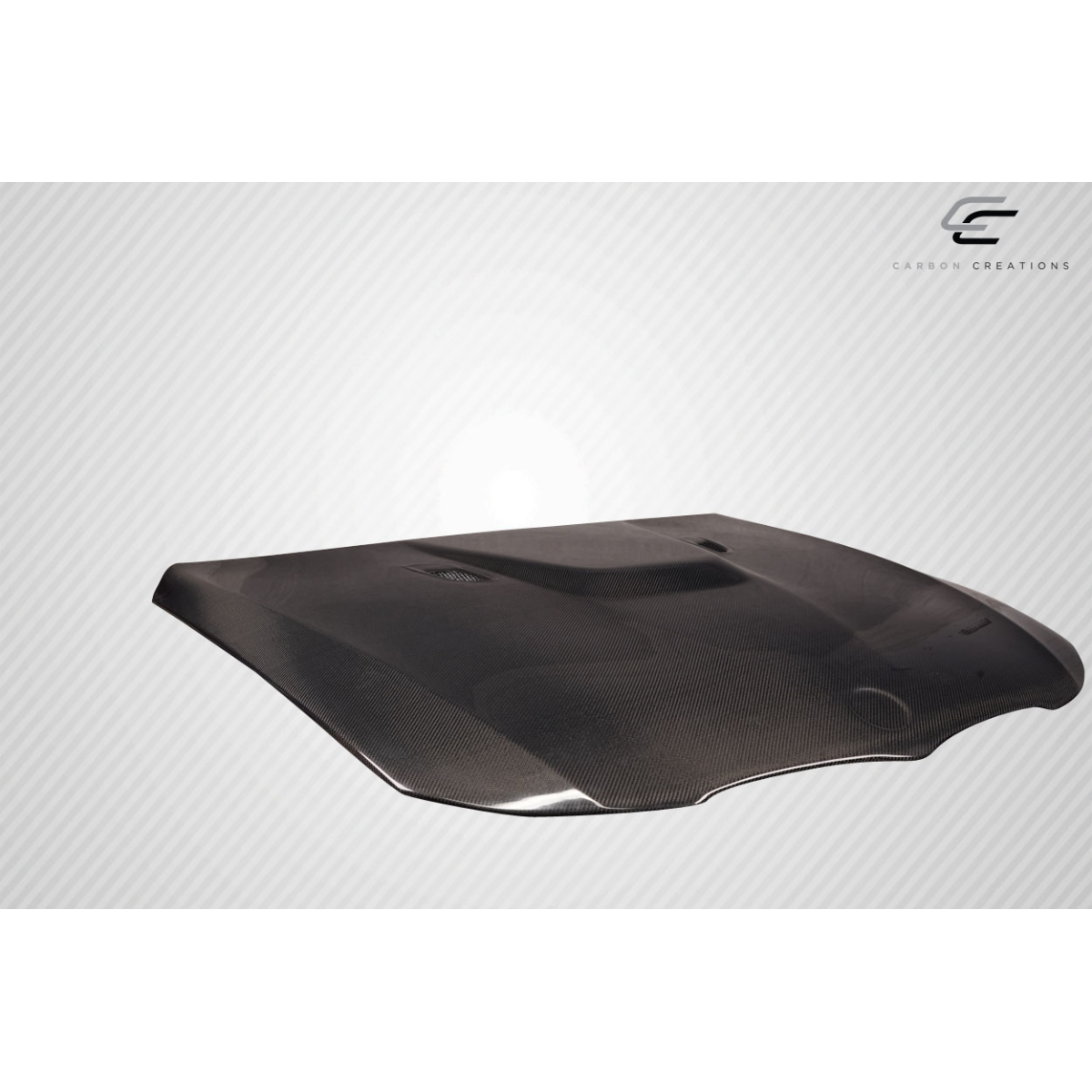 Modify your BMW 3-Series 2009 with our Exterior/Hoods - Angled view showcasing carbon fiber hood design