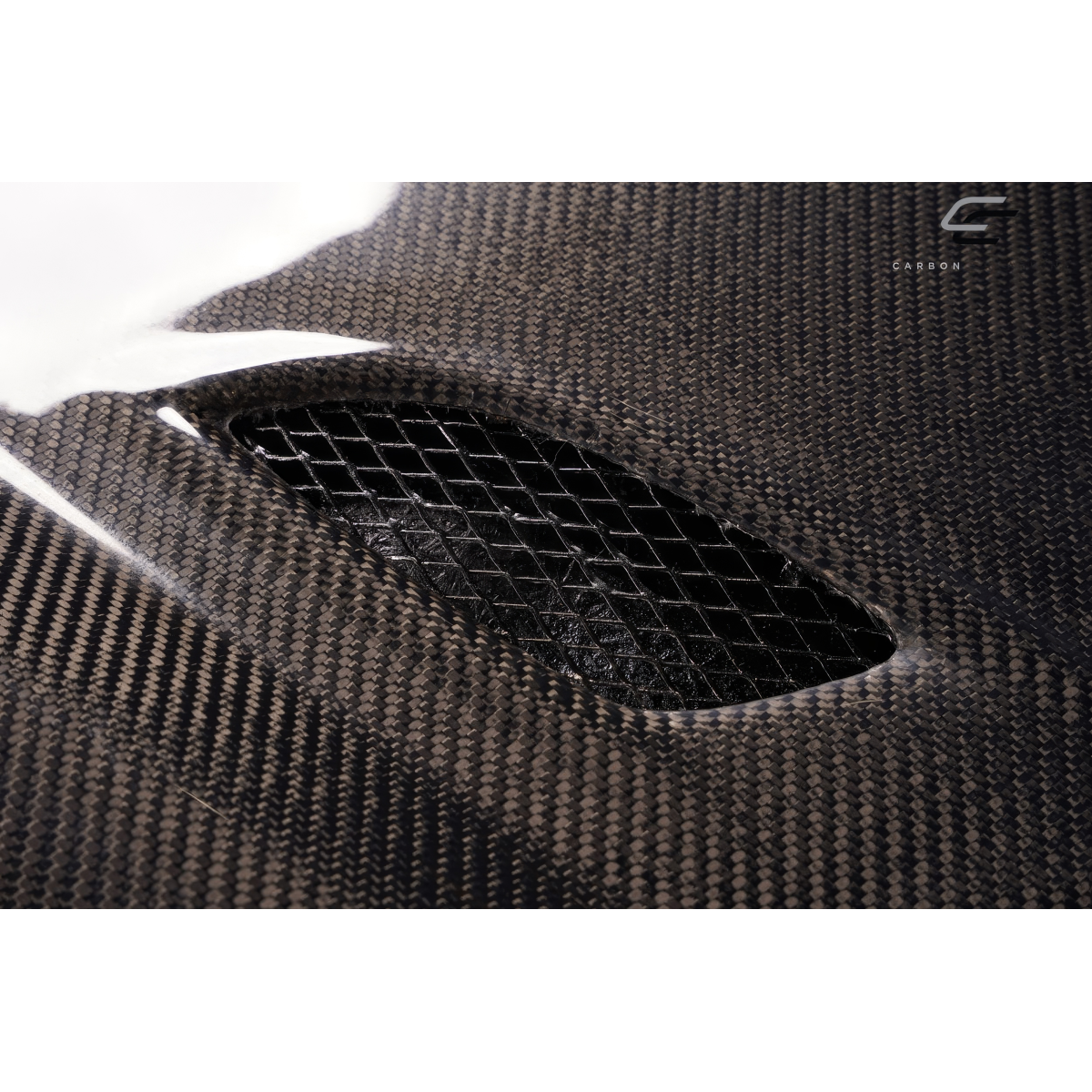 Modify your BMW 3-Series 2009 with our Exterior/Hoods - Angled view showing carbon fiber texture and vent