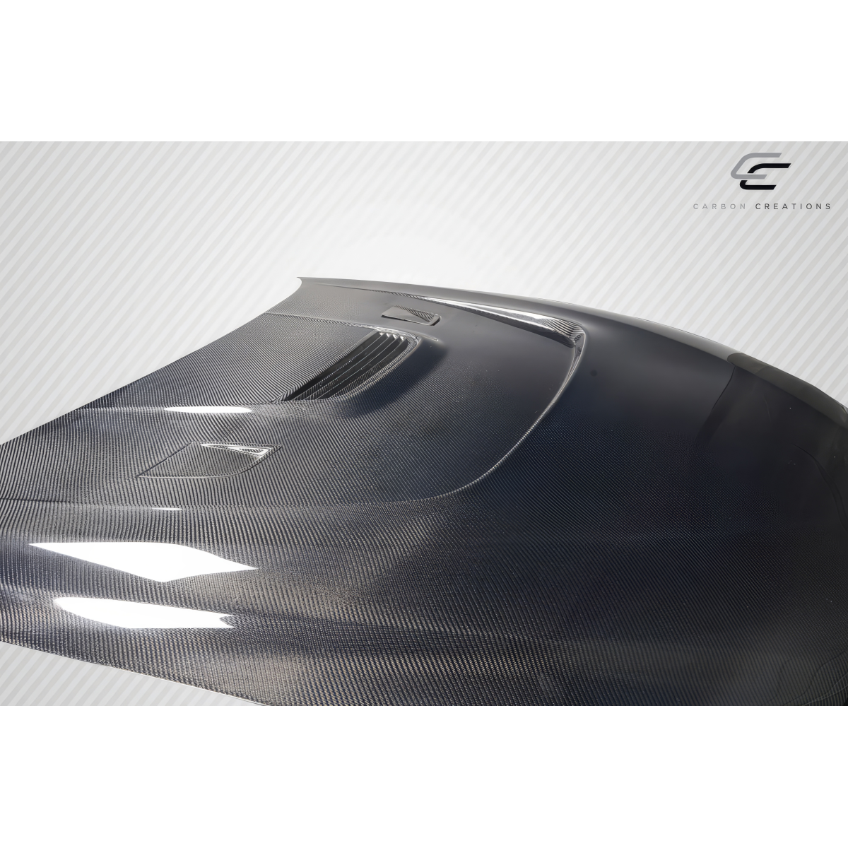 Modify your BMW 6-Series 2011 with our Exterior/Hoods - Angled side view showcasing carbon fiber finish