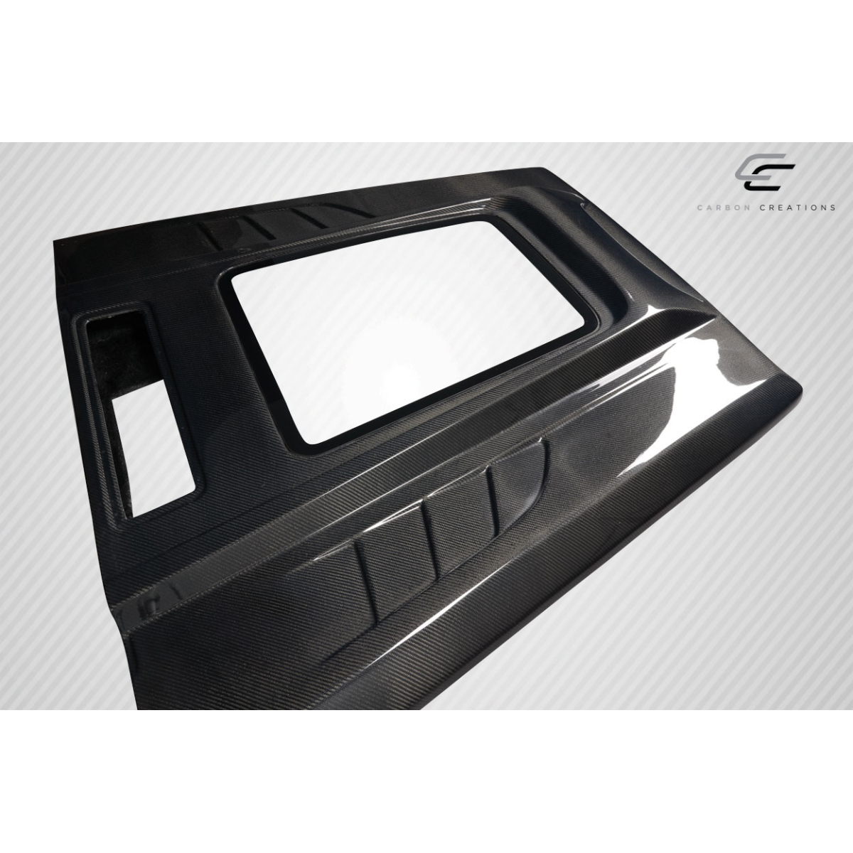 Modify your Mercedes-Benz G-Class 2000 with our Exterior/Hoods - Angled view of a carbon fiber hood part