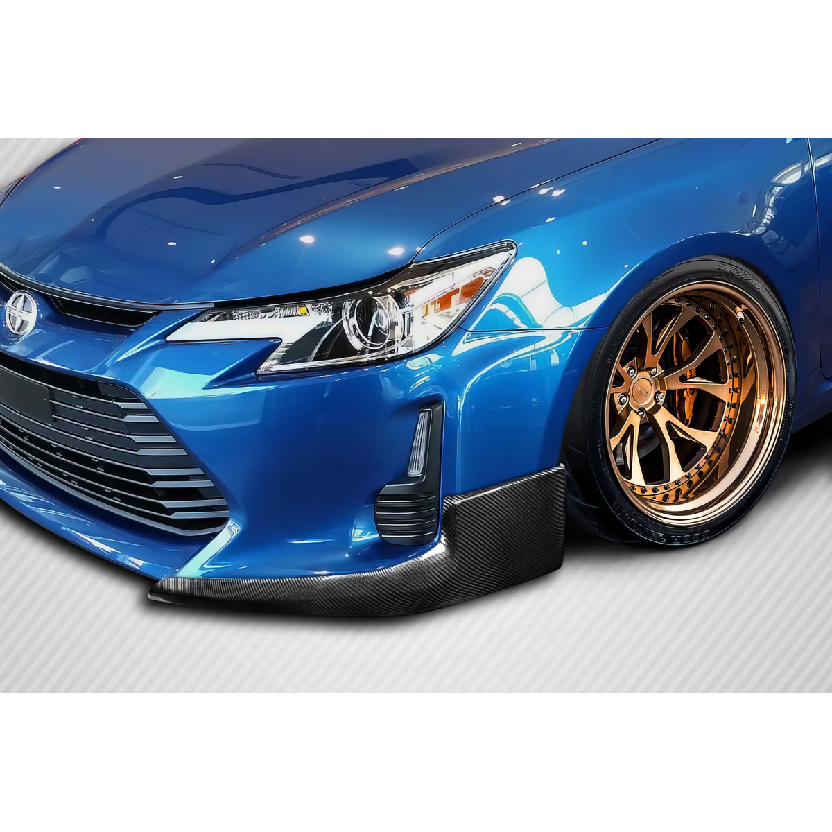 Modify your Scion tC 2011 with our Exterior/Front Bumpers or Lips - Front angled view of vehicle with lip spoiler