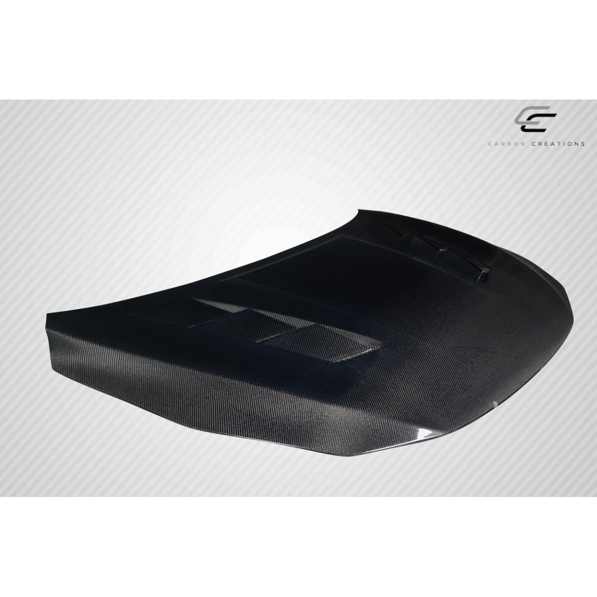 Modify your Nissan Sentra 2016 with our Exterior/Hoods - Angled view of a carbon fiber hood