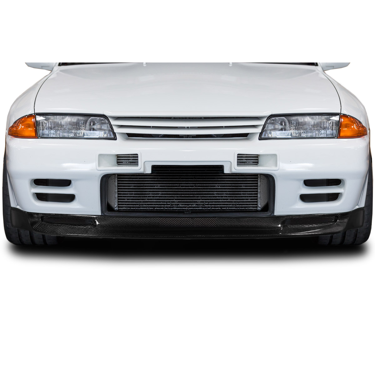 Modify your Nissan Skyline 1989 with our Exterior/Front Bumpers or Lips - Frontal view of the car part at eye level