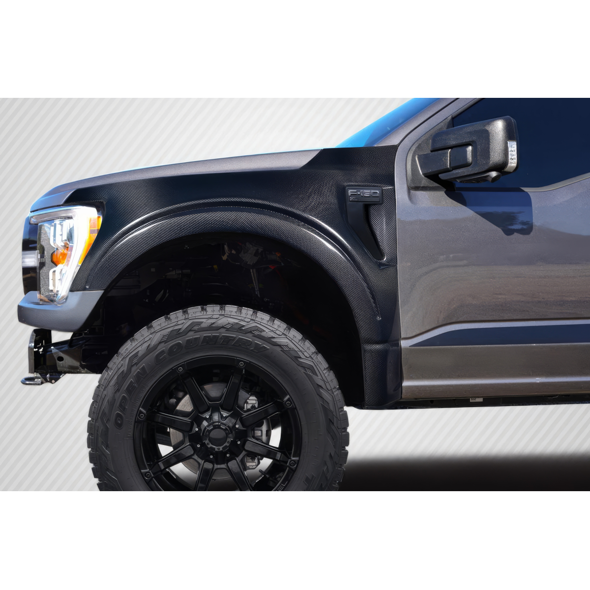 Modify your Ford F-150 2021 with our Exterior/Fenders - Angled view of carbon fiber front fender part