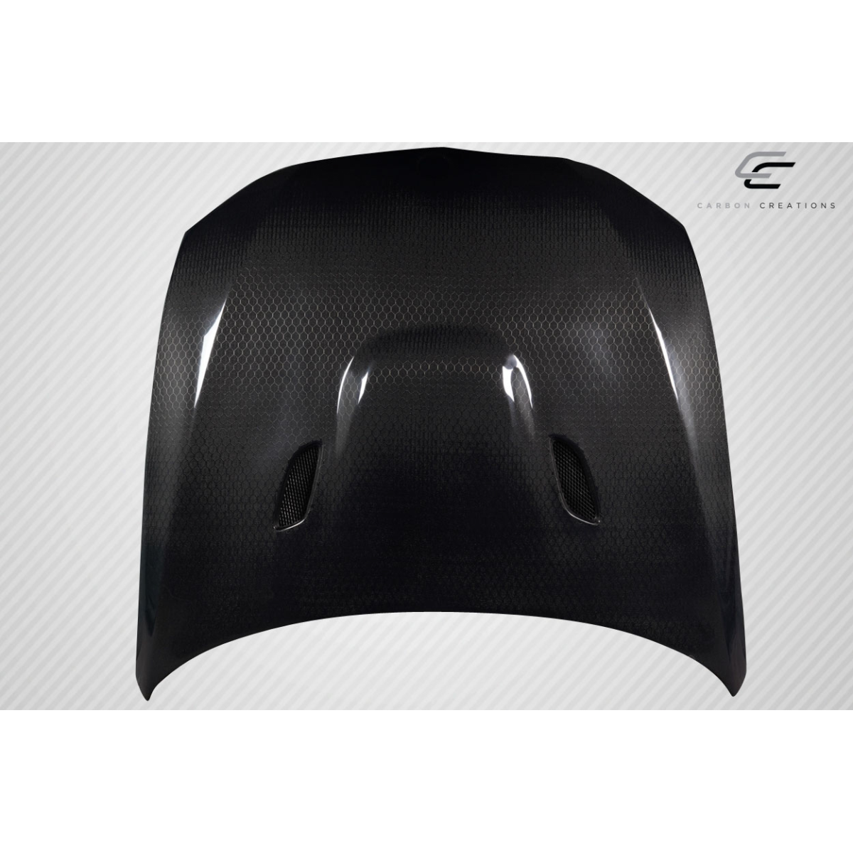 Modify your BMW 3-Series 2007 with our Exterior/Hoods - Front view of carbon fiber hood at slight angle