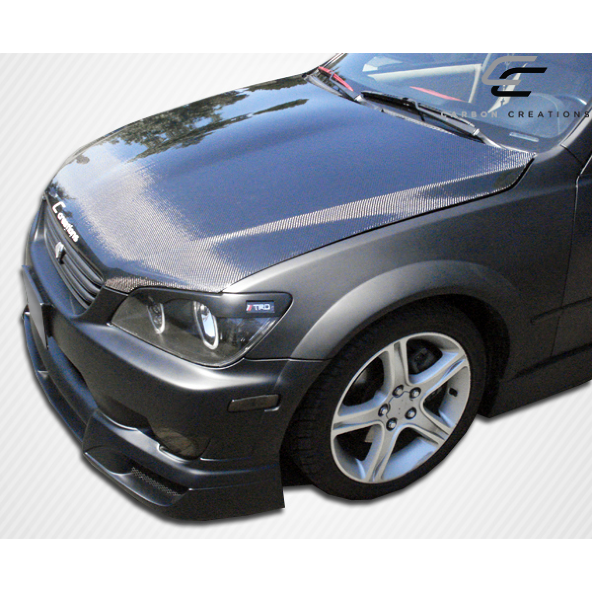 Modify your Lexus IS Series 2000 with our Exterior/Hoods - Front angle view of the hood and vehicle