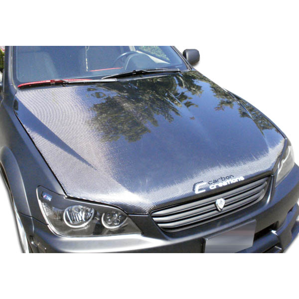 Modify your Lexus IS Series 2000 with our Exterior/Hoods - Viewed from the front at a slightly elevated angle