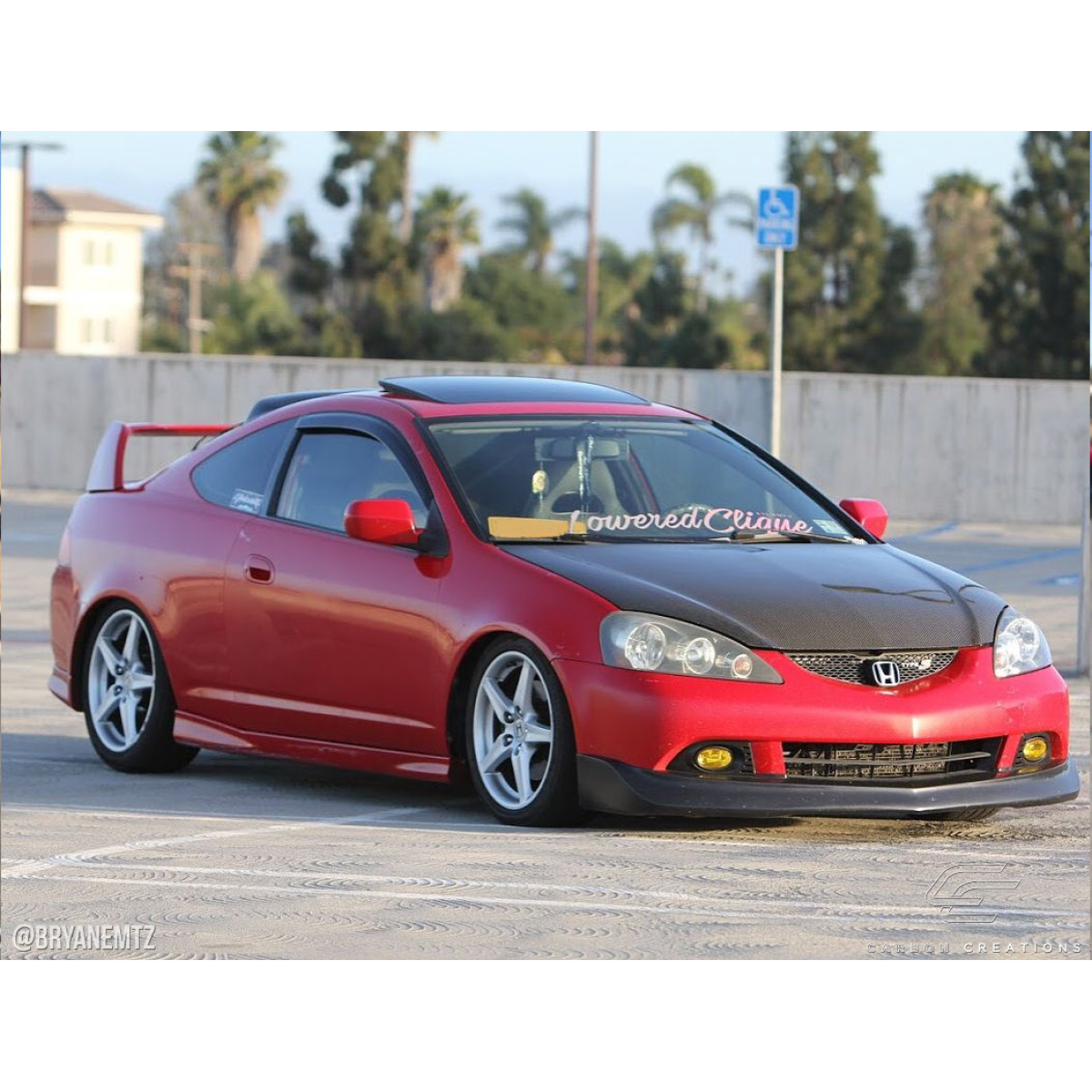 Modify your Acura RSX 2002 with our Exterior/Hoods - The vehicle is viewed from a slight angle front left