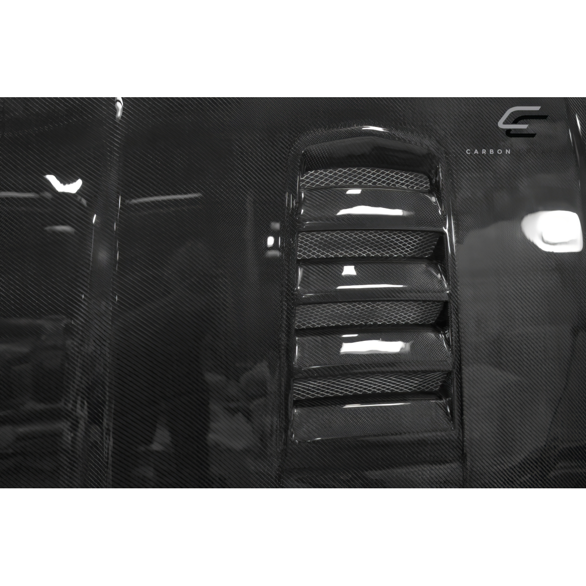 Modify your Chevrolet Camaro 2010 with our Exterior/Hoods - Angled view of hood showing carbon fiber texture