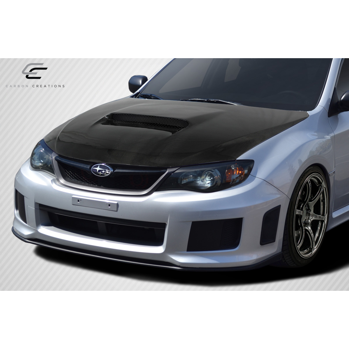 Modify your Subaru Impreza 2008 with our Exterior/Hoods - Front angle view showcasing the carbon fiber hood