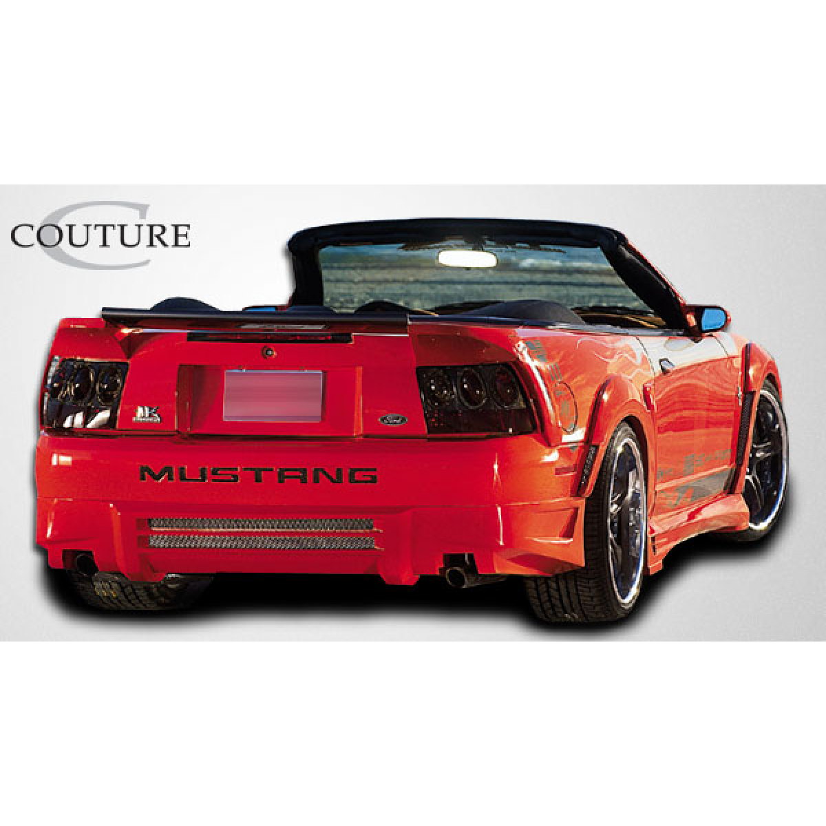 Modify your Ford Mustang 1999 with our Exterior/Fenders - Rear angle view of a Ford Mustang convertible