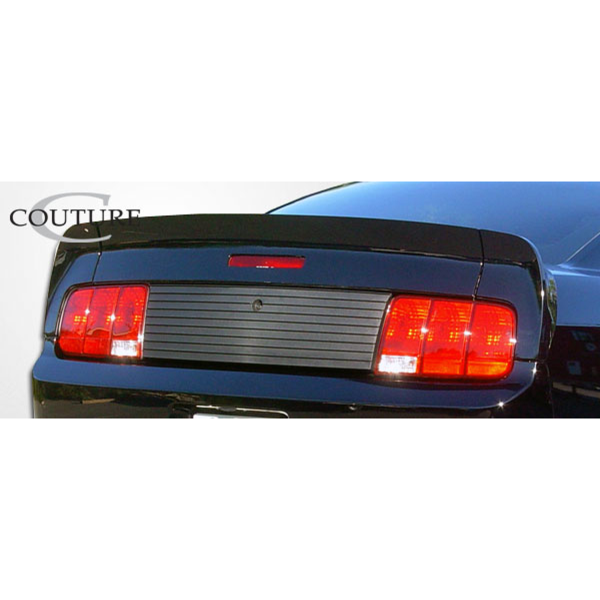 Modify your Ford Mustang 2005 with our Exterior/Wings - Rear view angle of spoiler on vehicle