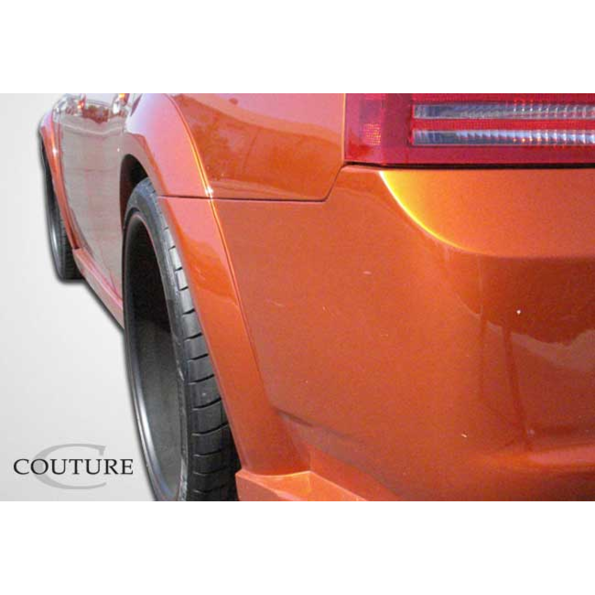 Modify your Dodge Charger 2006 with our Exterior/Complete Body Kits - Rear quarter view highlighting fender flares