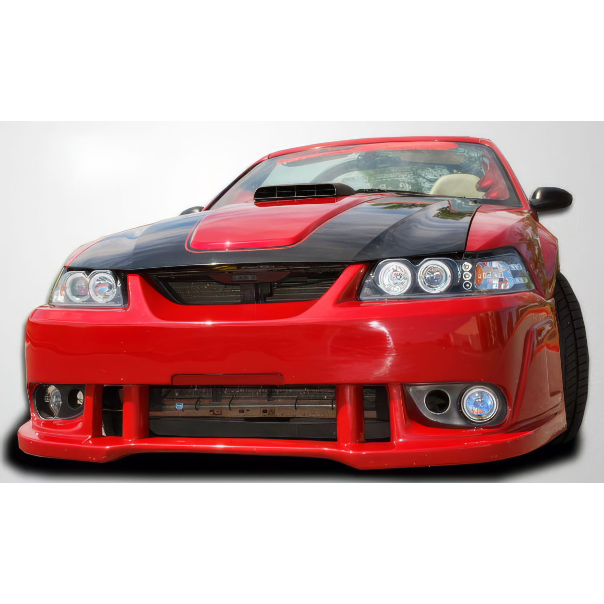 Modify your Ford Mustang 1999 with our Exterior/Front Bumpers or Lips - Front view of a modified red Ford Mustang