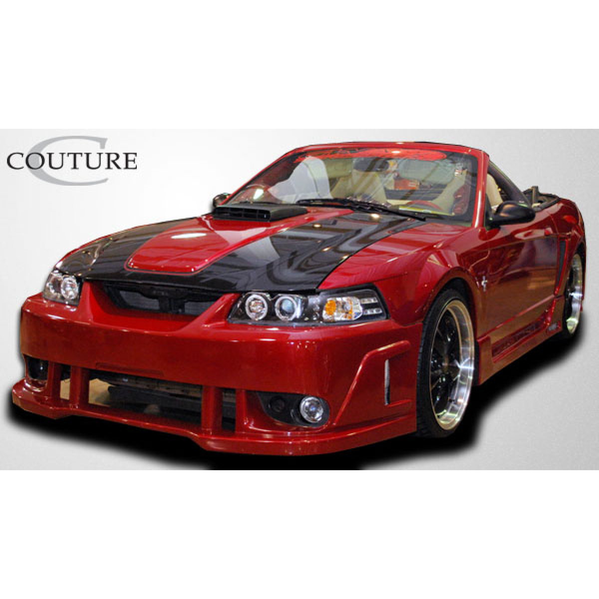 Modify your Ford Mustang 1999 with our Exterior/Side Skirts - Front three quarter angle view of a red Mustang