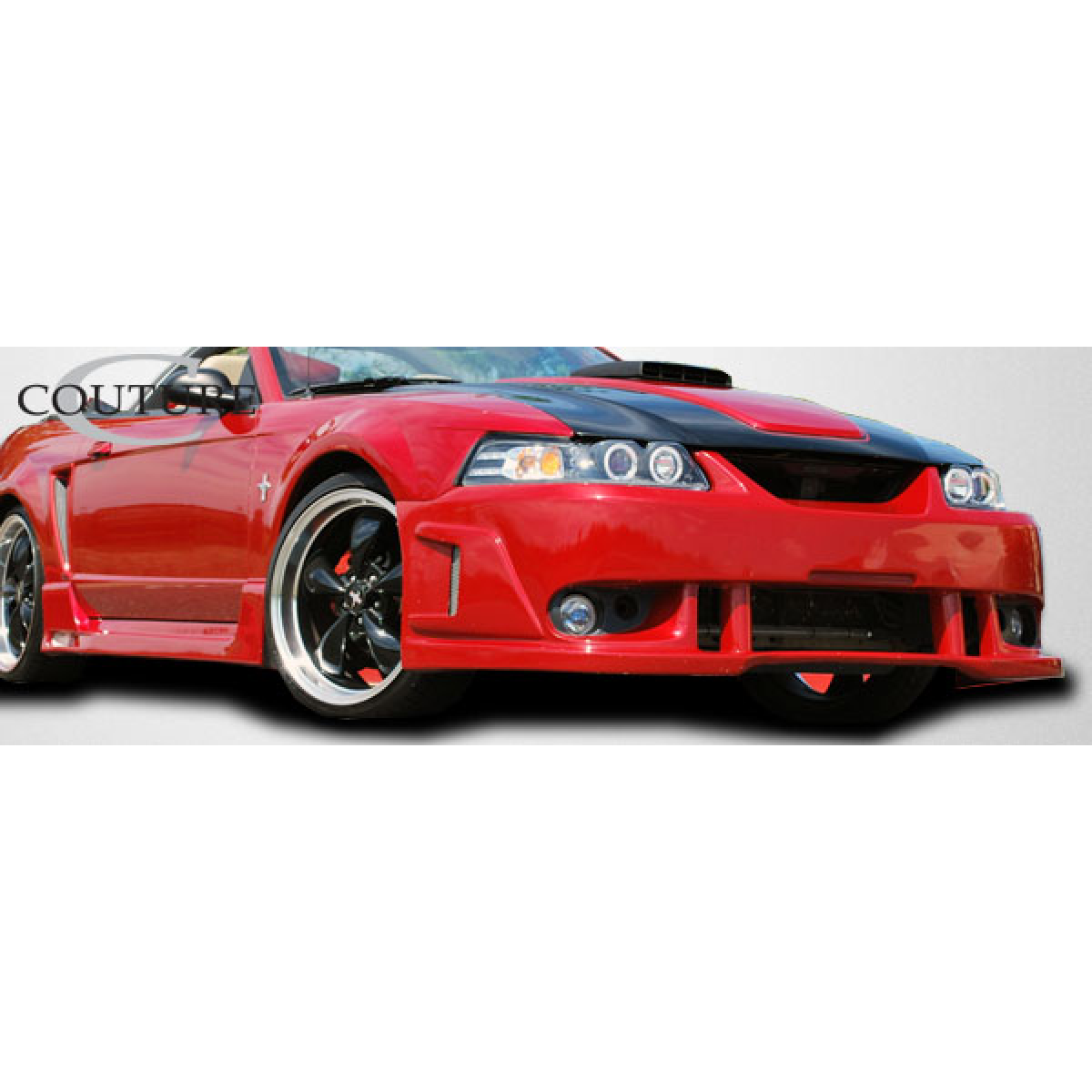 Modify your Ford Mustang 1999 with our Exterior/Side Skirts - Side angle view of vehicle showcasing side skirts