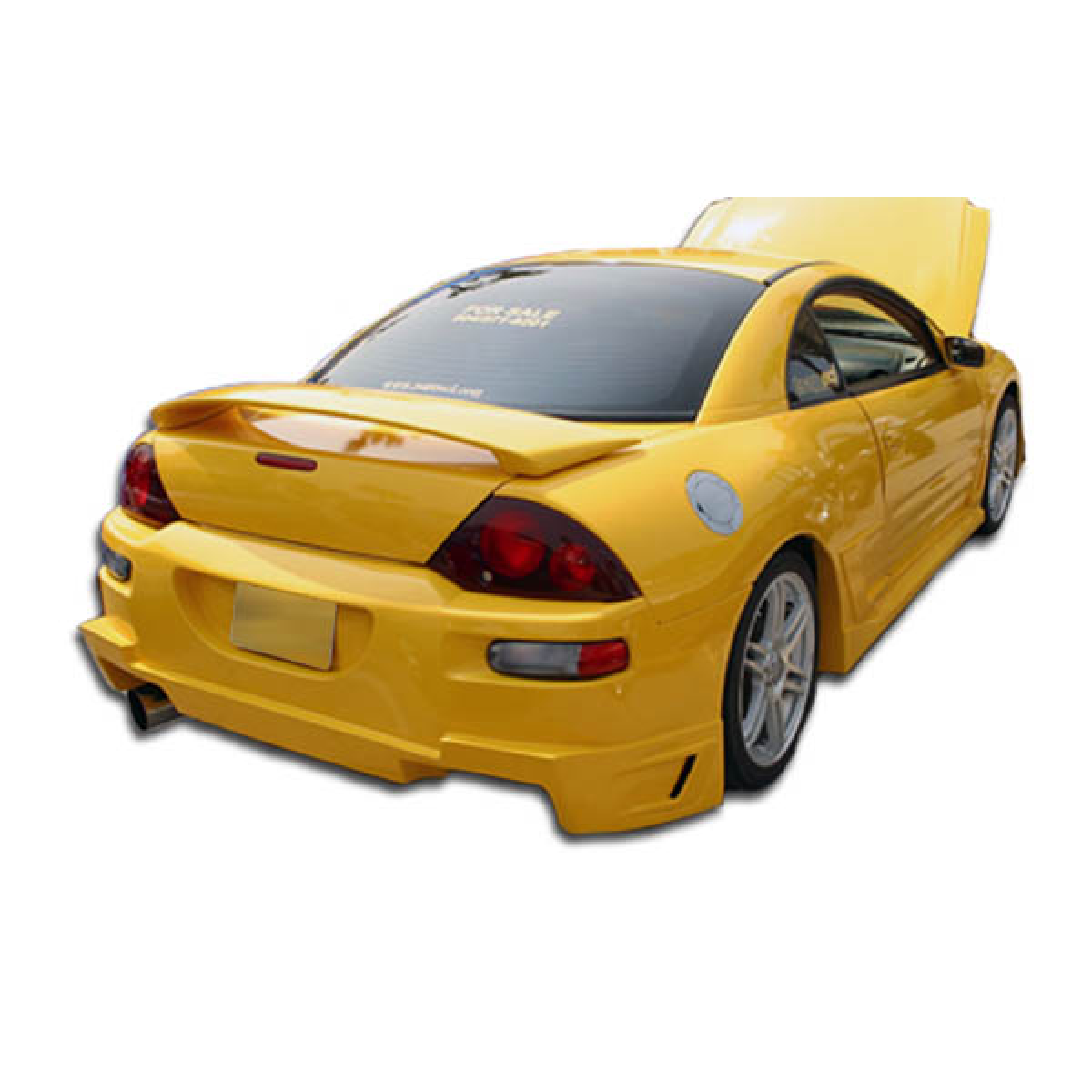 Modify your Mitsubishi Eclipse 2000 with our Exterior/Complete Body Kits - Rear three quarter angle view of a yellow car