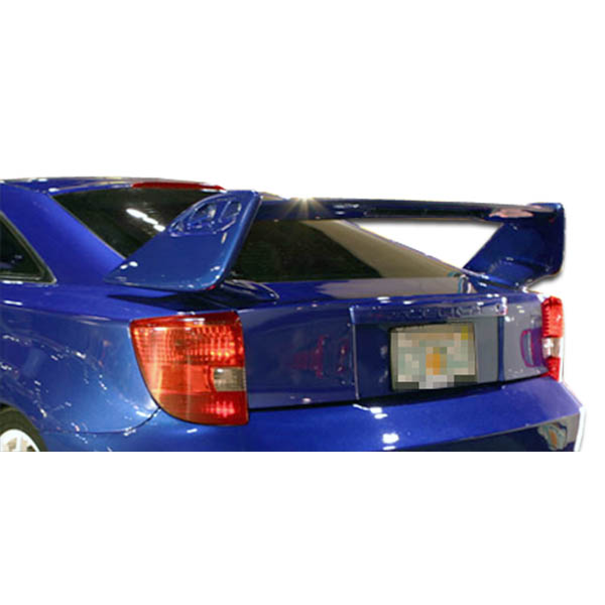 Modify your Toyota Celica 2000 with our Exterior/Wings - Rear angle view of spoiler on blue Toyota Celica