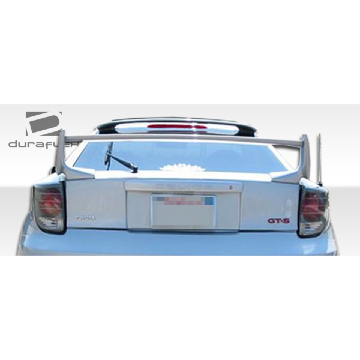 Modify your Toyota Celica 2000 with our Exterior/Wings - Rear angle view of trunk lid spoiler on vehicle