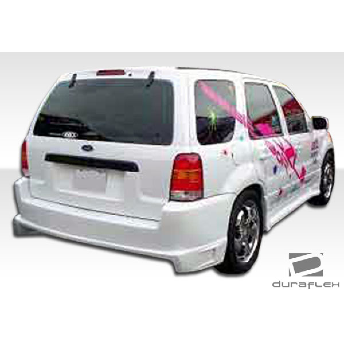 Modify your Ford Escape 2001 with our Exterior/Side Skirts - Right rear angle view of a modified Ford Escape