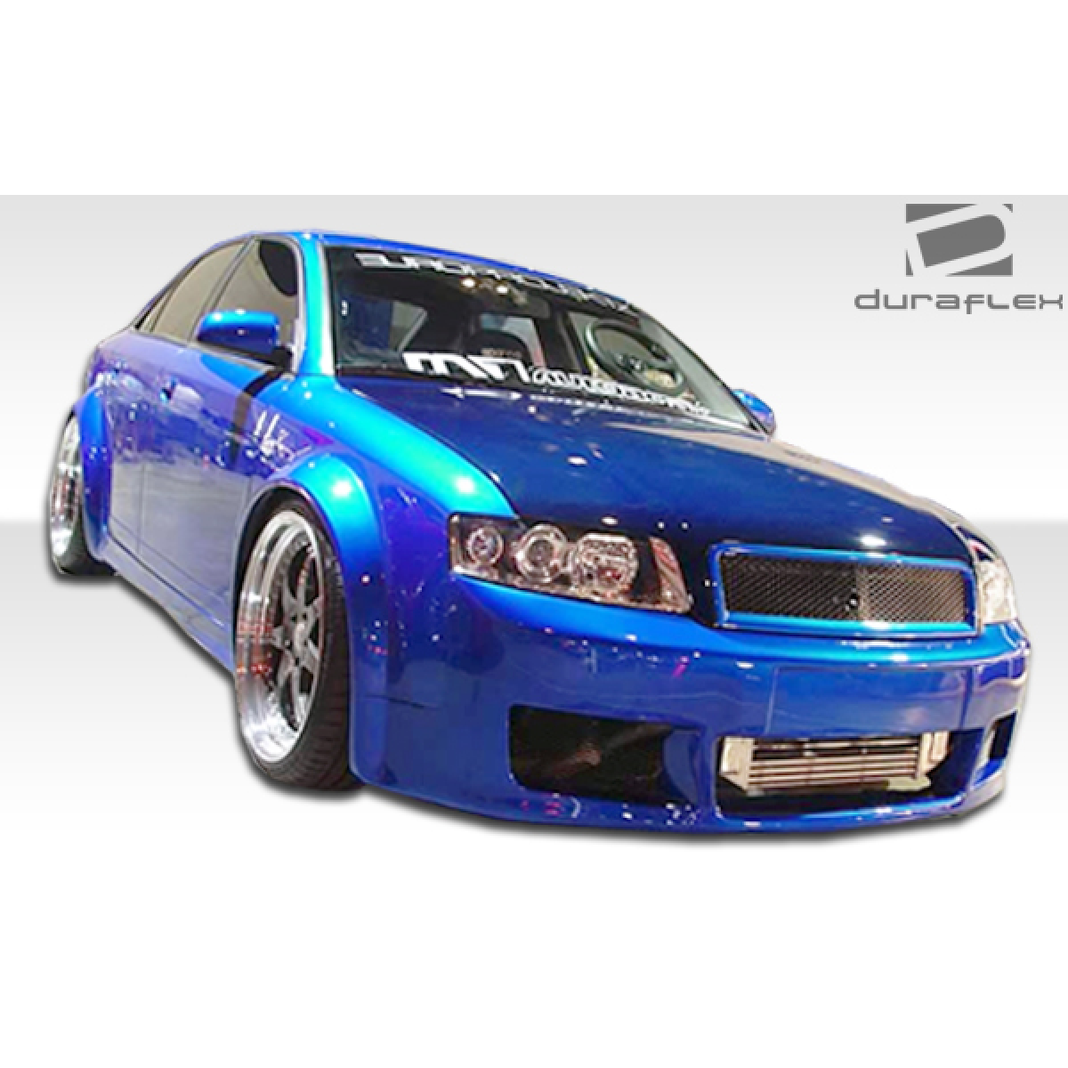 Modify your Audi A4 2006 with our Exterior/Complete Body Kits - Front left angle view of car showcasing side skirts