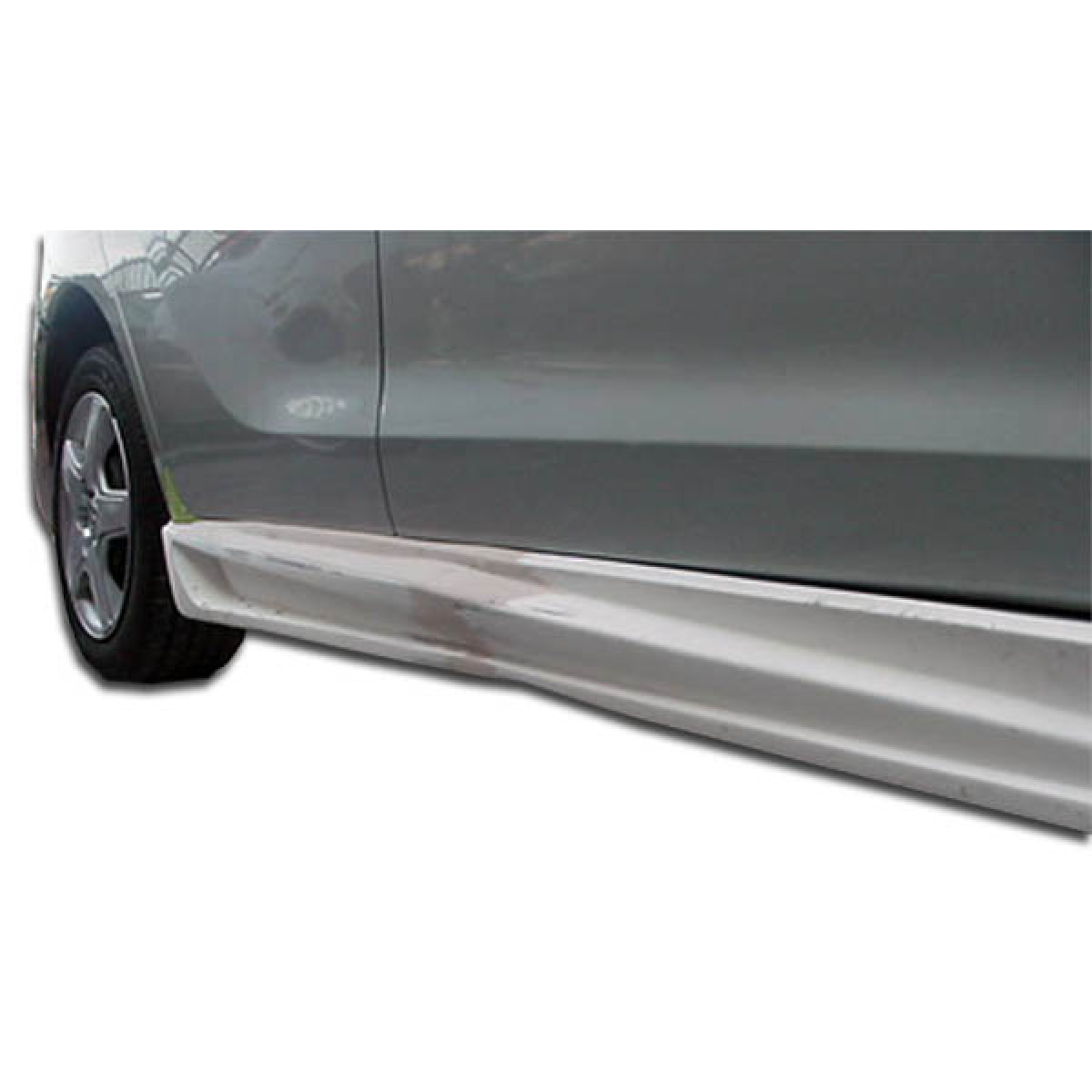 Modify your Toyota Matrix 2003 with our Exterior/Side Skirts - Side view showing side skirts at low angle