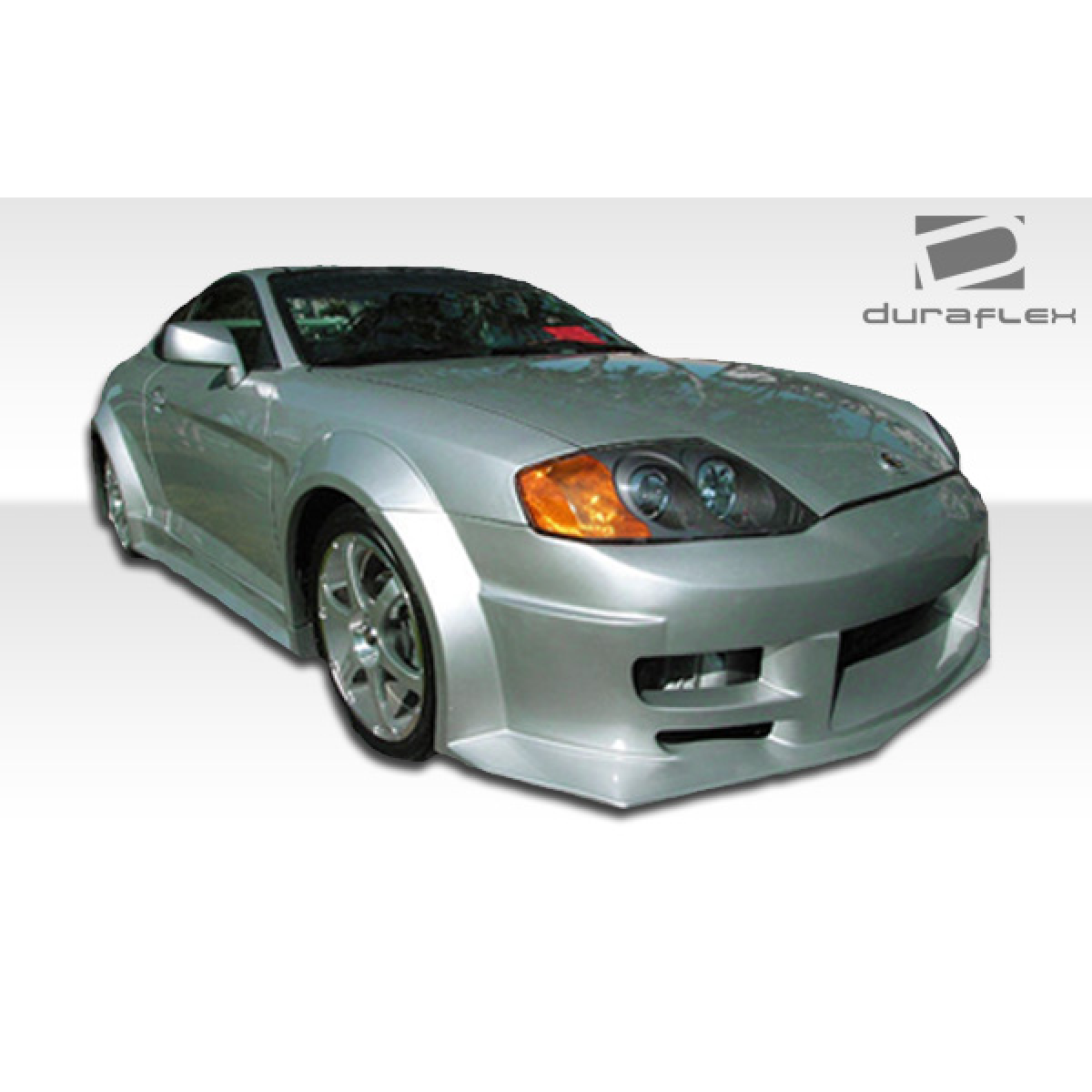 Modify your Hyundai Tiburon 2003 with our Exterior/Front Bumpers or Lips - Front angle view of a silver Hyundai Tiburon