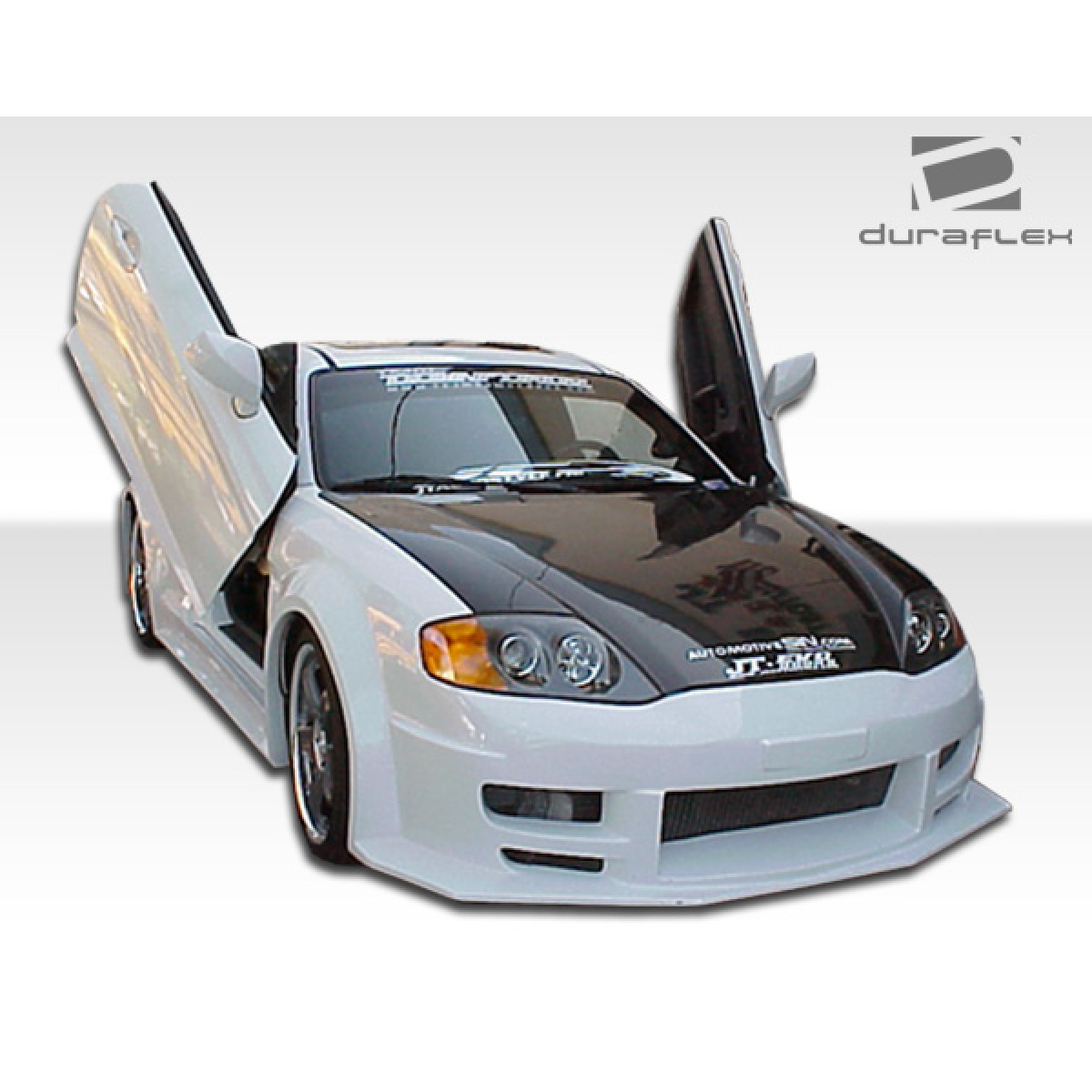 Modify your Hyundai Tiburon 2003 with our Exterior/Front Bumpers or Lips - Front view with doors open at an angle