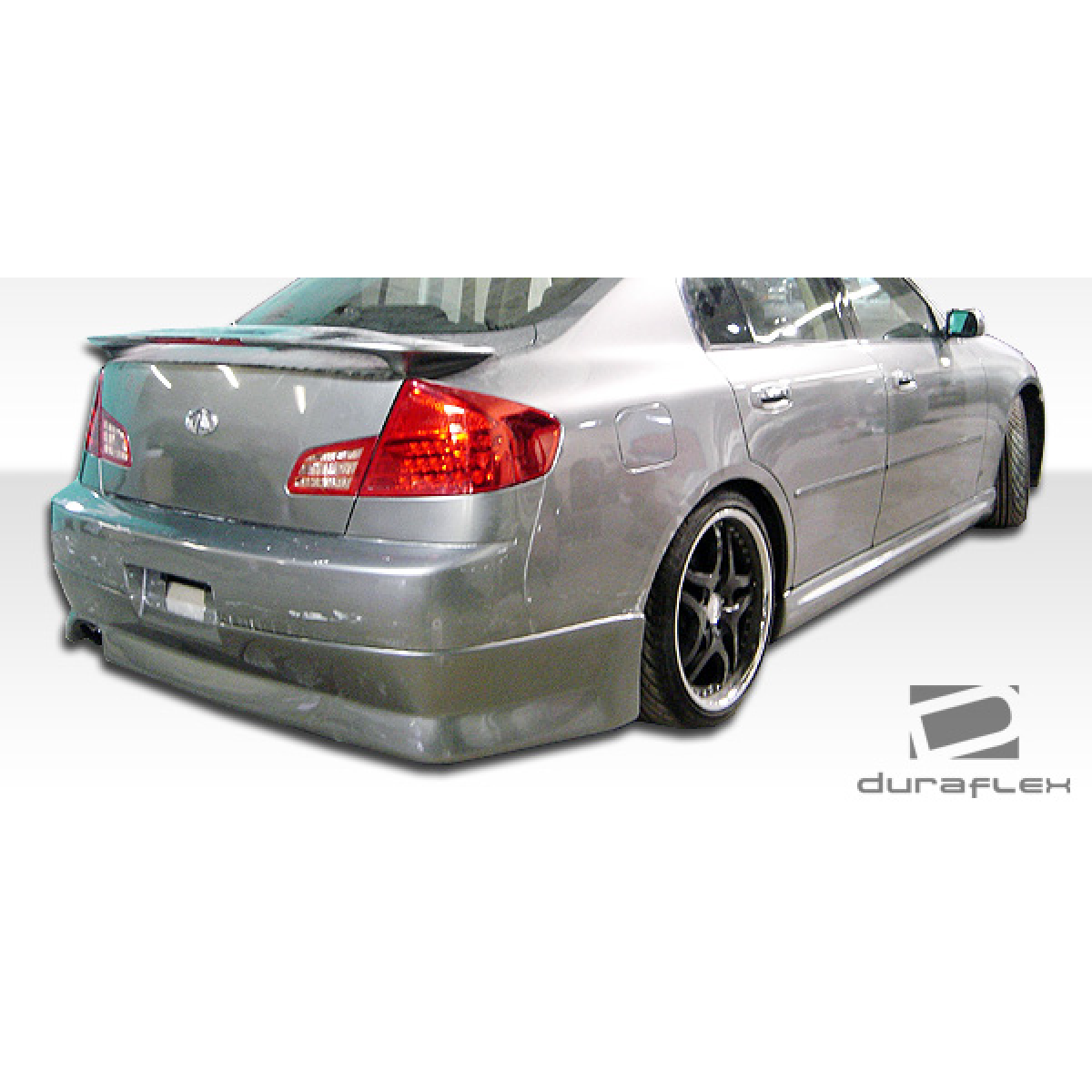 Modify your Infiniti G35 2003 with our Exterior/Complete Body Kits - Viewed from a slight rear three quarter angle