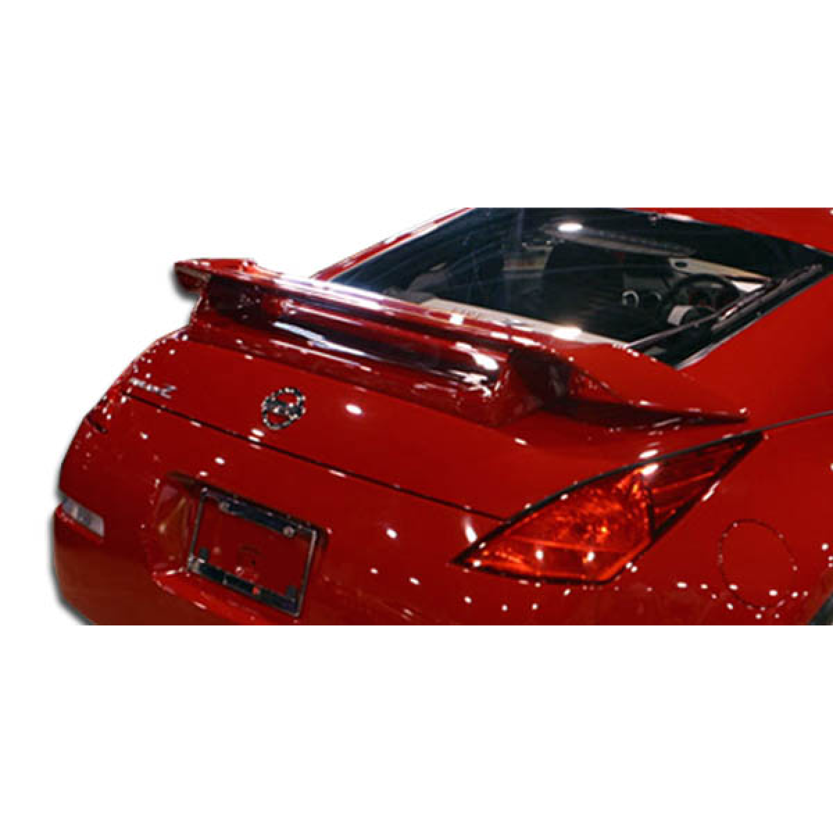 Modify your Nissan 350Z 2003 with our Exterior/Wings - Rear angle view of a red Nissan 350Z