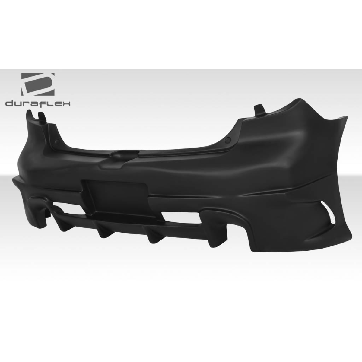 Modify your Mazda 3 2004 with our Exterior/Rear Bumpers or Lips - View from side angle showcasing rear bumper design