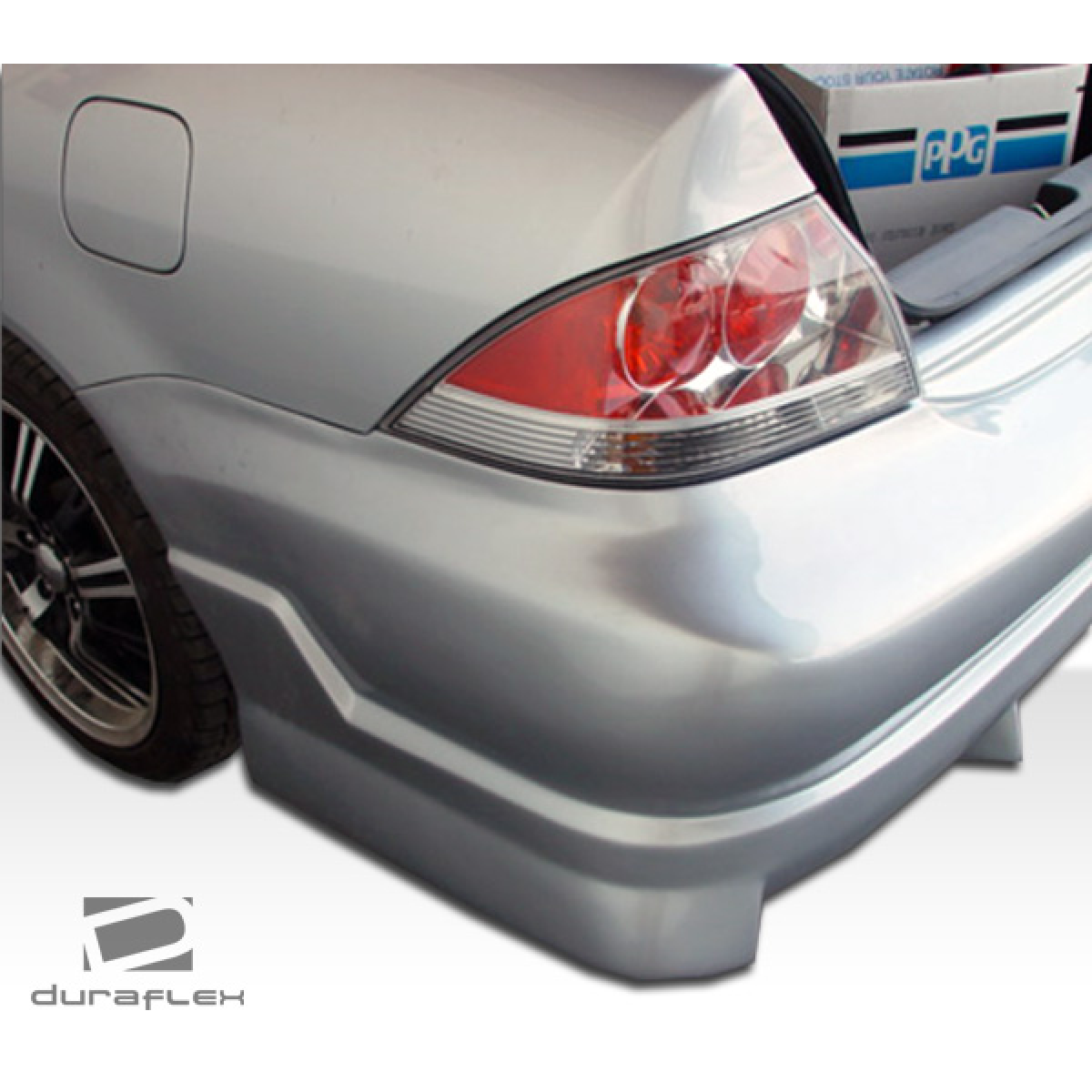 Modify your Mitsubishi Lancer 2004 with our Exterior/Complete Body Kits - Angled view from the rear passenger side