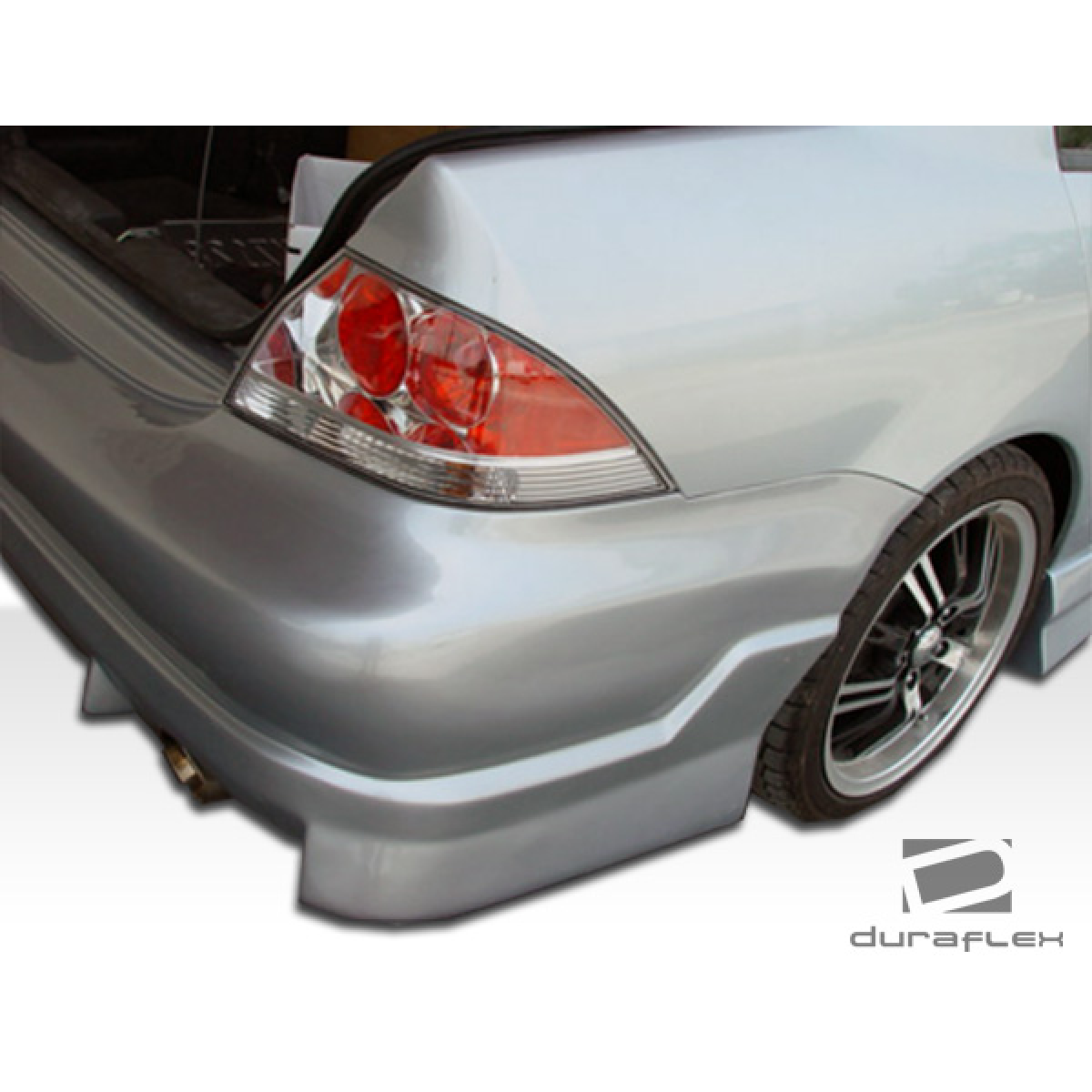 Modify your Mitsubishi Lancer 2004 with our Exterior/Complete Body Kits - Viewed from the rear at a slight angle