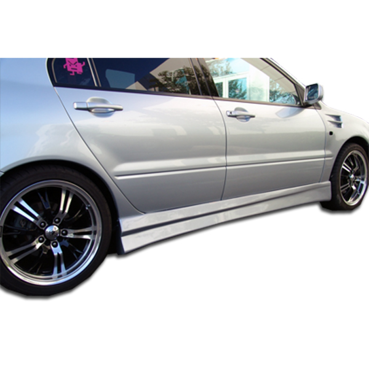 Modify your Mitsubishi Lancer 2004 with our Exterior/Complete Body Kits - Side view showcasing side skirts at low angle