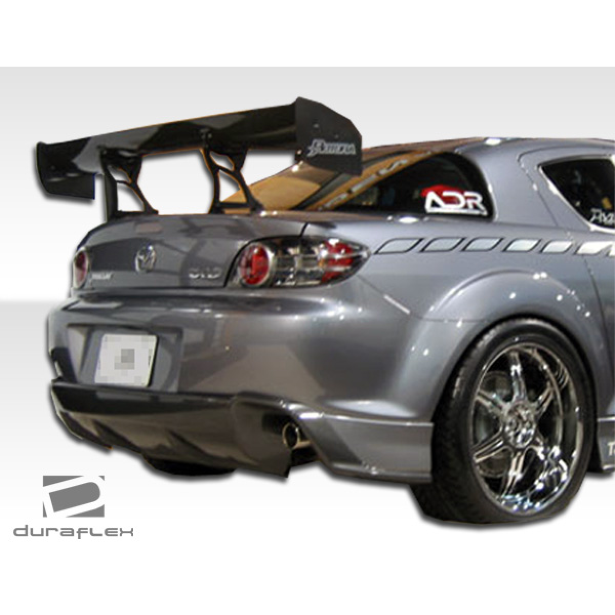 Modify your Mazda RX-8 2004 with our Exterior/Rear Bumpers or Lips - Rear view angle showing rear lip and wing