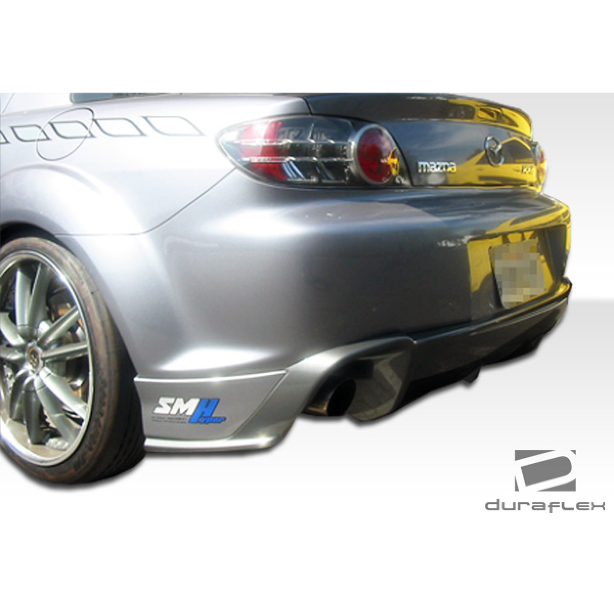 Modify your Mazda RX-8 2004 with our Exterior/Rear Bumpers or Lips - The image shows a rear angle of the car