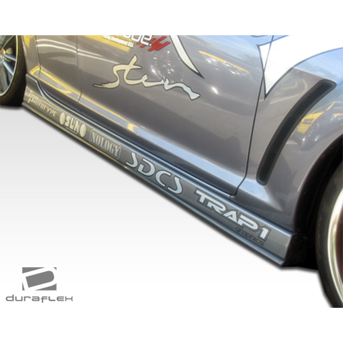 Modify your Mazda RX-8 2004 with our Exterior/Side Skirts - Side view angle of vehicle showcasing side skirts