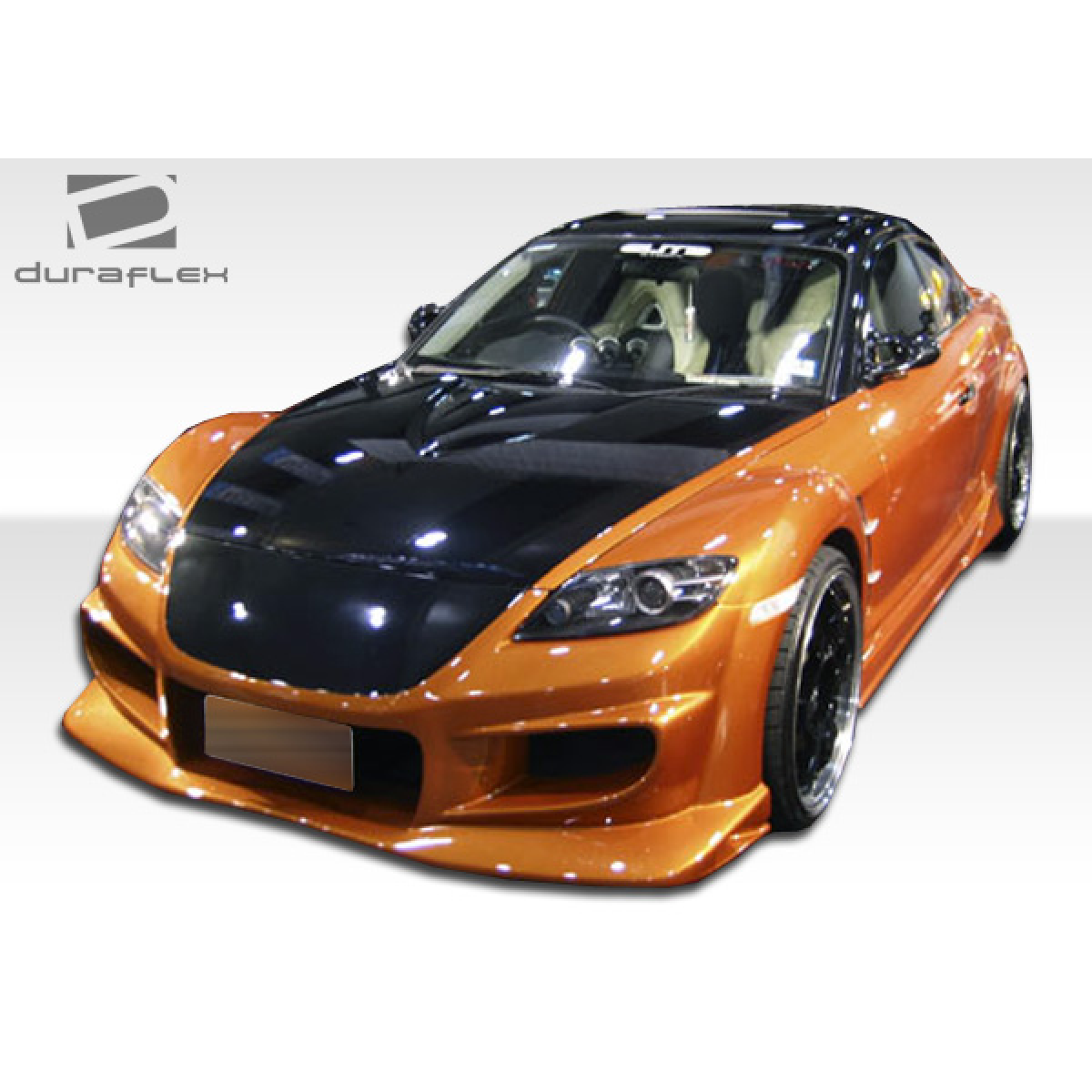 Modify your Mazda RX-8 2004 with our Exterior/Complete Body Kits - Front angle view of a modified Mazda RX-8