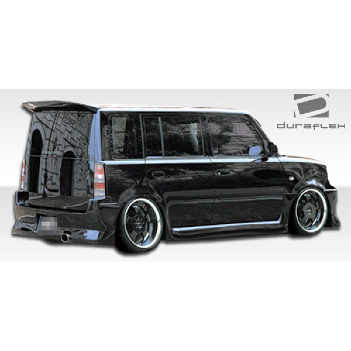 Modify your Scion xB 2004 with our Exterior/Complete Body Kits - Side angle view of a modified rear bumper