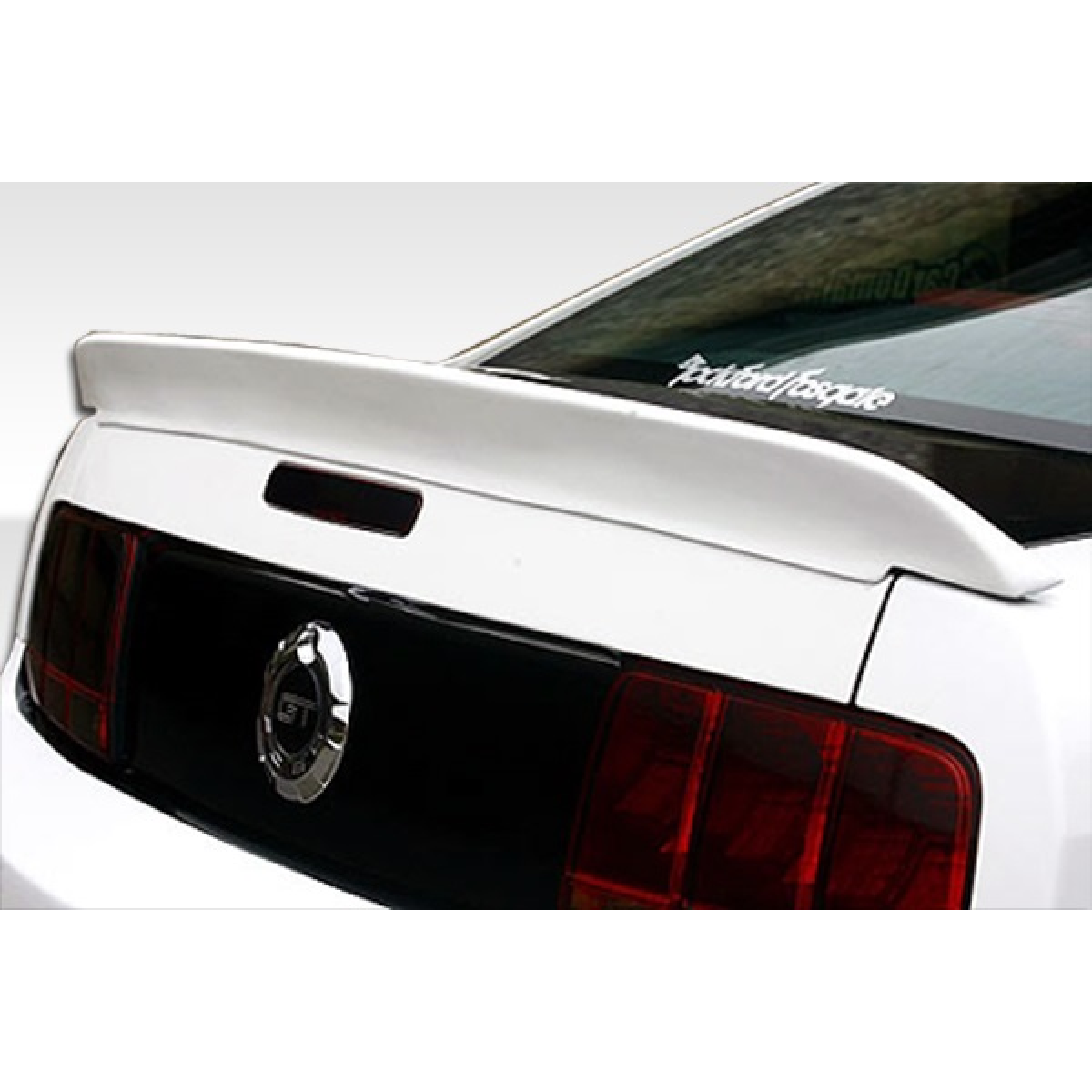 Modify your Ford Mustang 2005 with our Exterior/Wings - Rear view angle of a trunk lid spoiler