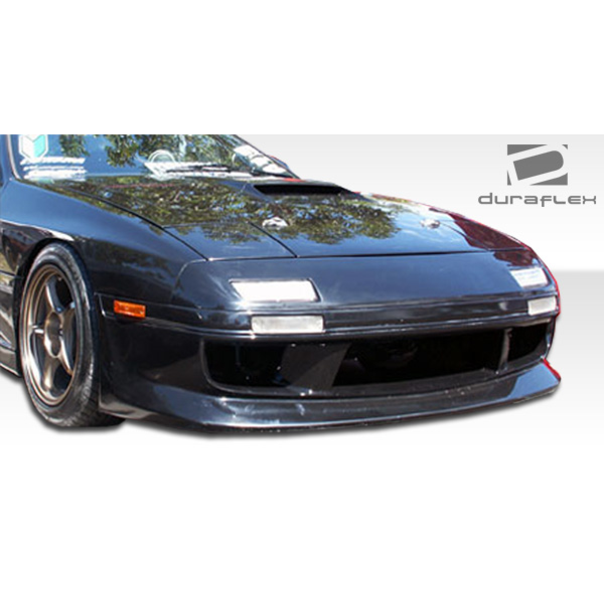 Modify your Mazda RX-7 1986 with our Exterior/Front Bumpers or Lips - Front angle view of bumper part