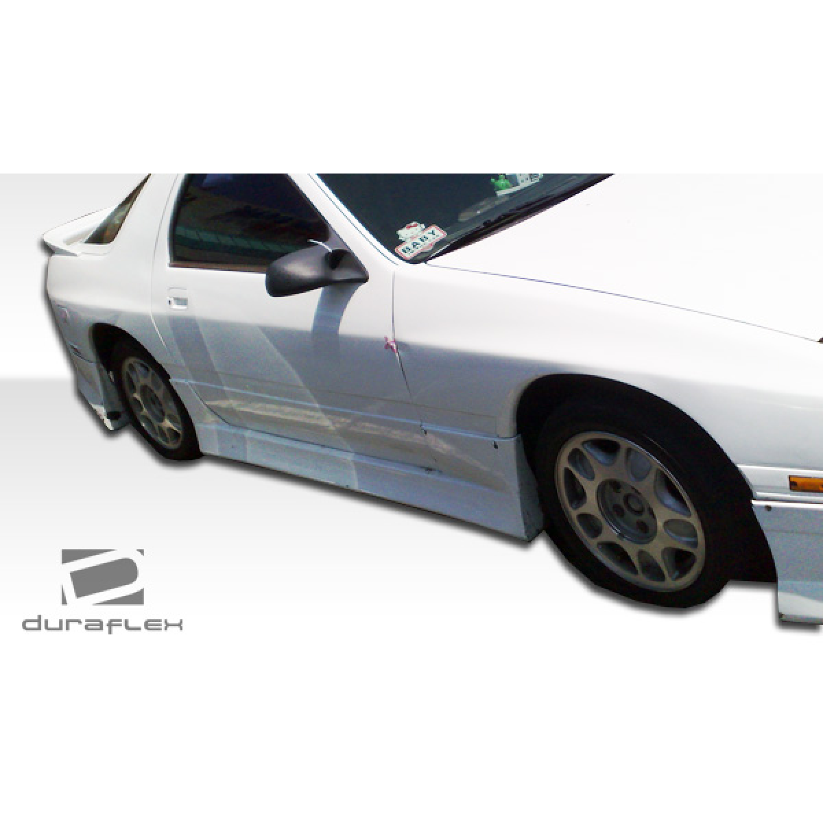 Modify your Mazda RX-7 1986 with our Exterior/Side Skirts - Angle shows side view of the vehicle part