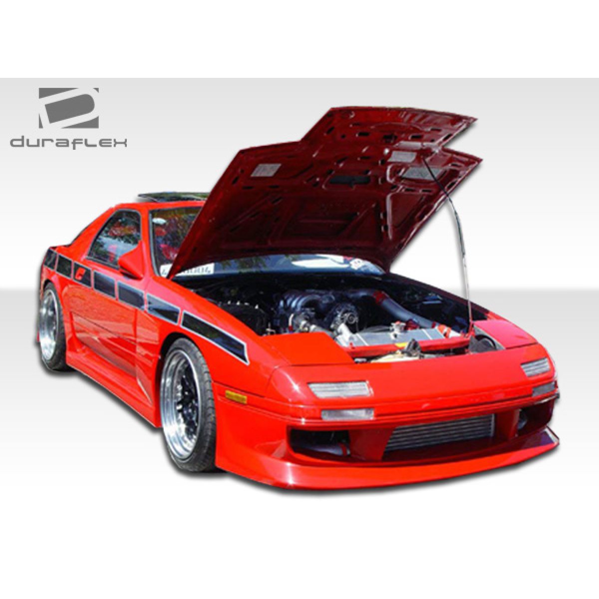 Modify your Mazda RX-7 1986 with our Exterior/Side Skirts - Front angled view of a modified car with hood raised