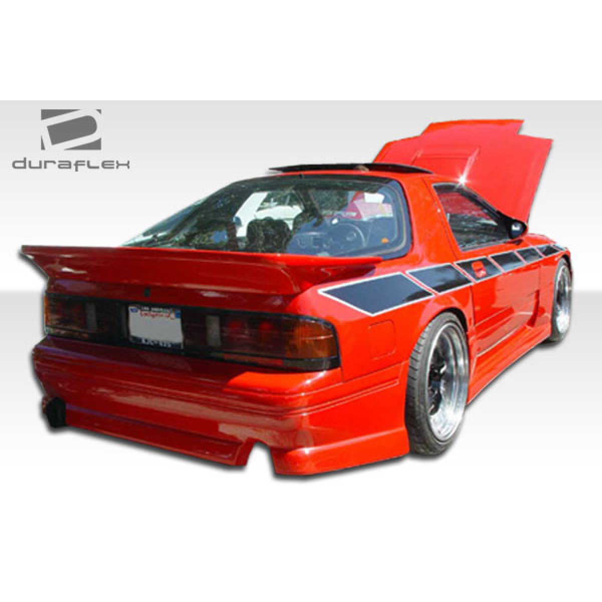 Modify your Mazda RX-7 1986 with our Exterior/Side Skirts - Rear angle showcasing body kit and styling